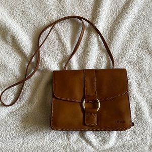 Vintage Crossbody Fossil purse with wallet features in back zippered pocket.